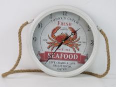 A restaurant style wall clock 'Todays Catch Fresh Seafood'