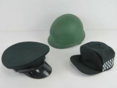 Three late 20th century military and police hats/ helmets.