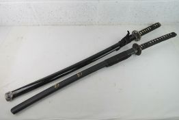 A modern Japanese Katana sword and scabbard, stainless steel blade,
