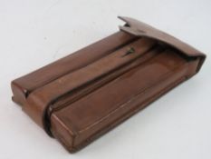 A WWII MP34 leather magazine pouch. Together with two MP34 magazines.