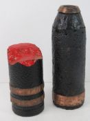 An inert WWI Shell head with a dual drive band, repainted.