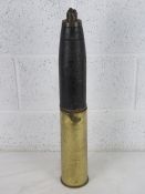 A WWI British shrapnel round with case, dated 1916.