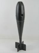 An inert British 20kg bomb with markings on the head W D.