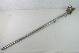 A reproduction WWI British sword and scabbard,wooden grips.