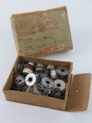 A WWII German sewing box with cotton reels and original cotton, with original labels - one dated 42.