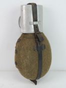 A WWII German Water bottle with cup, marked on the neck and dated 43, the cup looks to be dated 41,