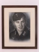 A photographic print heightened with black and white chalk, mounted, framed and glazed. Overall 34.