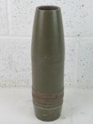 An inert 90MM M71 projectile, dated 1955, with original paint.