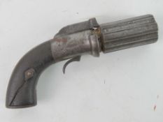 A obsolete calibre Pepperbox Pistol with broken grip.