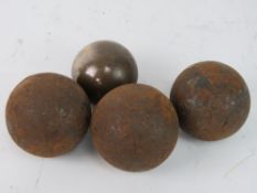 Cannon balls - a collection of 4 cannon balls including a bronze / brass cannon ball 2 5/8 in ( 6.