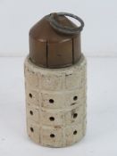 An inert Elgian practice defence grenade, with fuse and pin, top unscrews from the body.