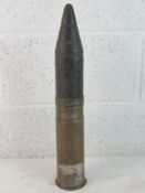 An inert WWII German 7.5cm Kwk Armour Piercing shell, dated 1942 with German marks upon. Approx.