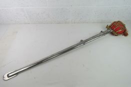 A reproduction 18th Century Scottish Basket hilt broad sword with scabbard.