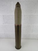 An inert WWI German Howitzer 105mm shell, Dated 1915 Magdenburg casing, has been repainted.