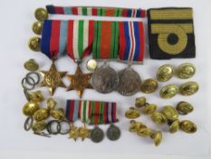 A WWII medal set comprising War, Defence, Italy Star and 1939-45 Star, and matching miniatures.