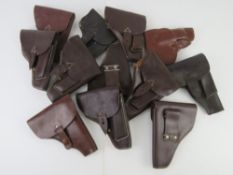 Twelve PPK Leather holsters.