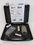 A Tactical torch and laser with pressure pad in box, with spare batteries, and accessories,