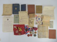 A quantity of militaria including WWII medals, identity card, etc.