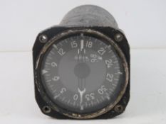 An aircraft indicator bearing Heading Distance instrument, PT No. 104470.