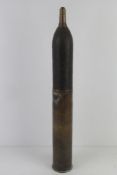 An inert WWI French 75mm HE shell, dated 1918 and marked at the bottom of the casing.