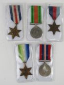 Five WWII Medals which includes defence medal, 1939-1945 medal, 1939-1945 star,