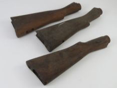 Three Enfield wooden stocks
