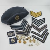 An RAF beret by Kangol, size 6 7/8 with badge upon, together with RAF buttons, cloth badges etc.