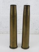 Two inert brass shell cases