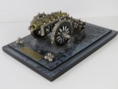 A metal model of an artillery cannon 'Presented by Director General Ordnance Pakistan Army',