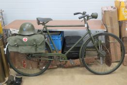 A Military bicycle having Swedish flag emblem upon, over painted, with reproduction accessories