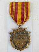 A WWII 1940 Dunkirk medal with ribbon.