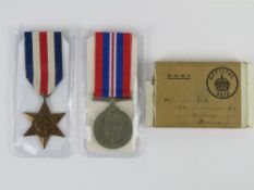 Two WWII Medals and original box having Hastings address; France & German Star and War medal.