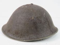 A British military helmet with liner.