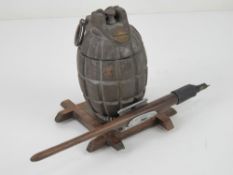 An inert Mills Grenade made into an ink