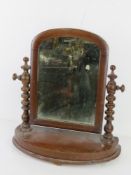 An Edwardian mahogany toilet mirror, 46cm wide.