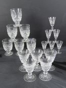 Waterford Crystal; a set of six footed goblets and a set of five sherry glasses.
