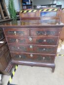 A chest of two short over three long drawers over base, 97 x 58 x 107cm.