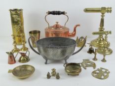A quantity of assorted brass ware including a pair of graduated goffering iron stands and a WWI