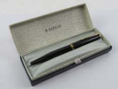 A Parker fountain pen in original box with original guarantee dated 1969 and additional cartridges.