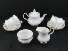 A Royal Albert tea set comprising teapot, jug, sugar and four cups and saucers, Val D'or pattern.