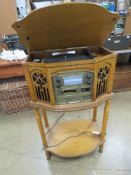 A Steepletone Canterbury entertainment centre having turntable, radio and cd player.
