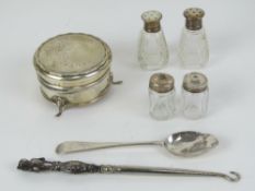 Two pairs of cut glass and silver cruets,