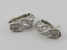 A pair of 14ct white gold earring set with white stones, stamped 585, 3.89g.