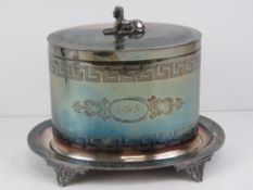 An Egyptian Revival silver plated buscuit barrel having Sphinx top finial and key pattern engraving