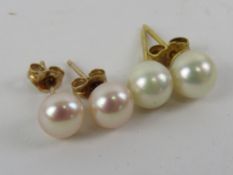 Two pairs of pearl stud earrings, no hallmarked on pair of butterfly backs marked for 14ct gold.