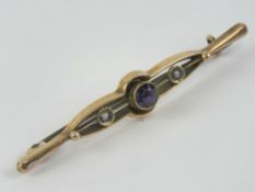 A 9ct gold amethyst and seed pearl bar brooch, stamped 9ct, 5.4cm wide, 1.7g.