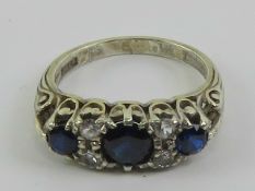 An Asprey & Co vintage 9ct gold sapphire ring, the central round cut royal blue sapphire approx 0.