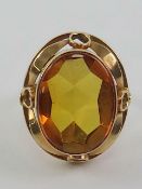 A large and impressive orange citrine cocktail ring,