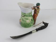 A hunting themed ceramic jug together with a horse head shoe horn.