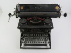 A vinatge black painted 'Imperial' typewriter.
